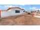 Single-story home with a white exterior and a barren front yard awaiting landscaping at 1309 Jimmy Ave, Las Vegas, NV 89106