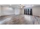 Spacious living room featuring hardwood floors, modern lighting and neutral paint at 1309 Jimmy Ave, Las Vegas, NV 89106