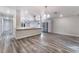 Spacious open-concept living area with gray flooring connecting the kitchen and entryway at 1309 Jimmy Ave, Las Vegas, NV 89106