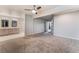 Spacious main bedroom featuring a ceiling fan, plush carpeting and an ensuite bathroom with double vanities at 1309 Jimmy Ave, Las Vegas, NV 89106