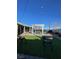 Inviting backyard featuring a pergola, artificial grass, and a patio area perfect for entertaining at 1737 W Nelson Ave, North Las Vegas, NV 89032