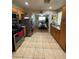 Well-lit kitchen featuring stainless steel appliances and tile flooring throughout with eating area at 1737 W Nelson Ave, North Las Vegas, NV 89032