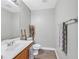 Simple bathroom with wood vanity and gray walls at 1903 Sundown Canyon Dr, Henderson, NV 89014