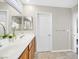 Clean bathroom with double vanity and wood cabinets at 1903 Sundown Canyon Dr, Henderson, NV 89014