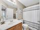 Bathroom with wood vanity, shower, and neutral tones at 1903 Sundown Canyon Dr, Henderson, NV 89014