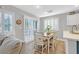 Bright dining area with table and chairs near sliding doors at 1903 Sundown Canyon Dr, Henderson, NV 89014