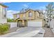 Two-story house with attached garage and landscaped front yard at 1903 Sundown Canyon Dr, Henderson, NV 89014