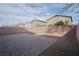 Enclosed backyard featuring a stone patio and low-maintenance desert landscaping, perfect for outdoor entertaining at 2240 Sky Island Dr, Henderson, NV 89002