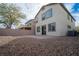 Large backyard featuring a patio, desert landscaping, and a view of the home's rear elevation at 2240 Sky Island Dr, Henderson, NV 89002