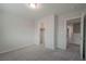 Bedroom with plush gray carpet and neutral walls, closet, and doorway at 2240 Sky Island Dr, Henderson, NV 89002