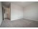 Spacious bedroom with plush gray carpet, a doorway, and neutral-colored walls at 2240 Sky Island Dr, Henderson, NV 89002