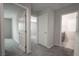 Hallway featuring plush gray carpeting and doorways leading to the home's rooms at 2240 Sky Island Dr, Henderson, NV 89002