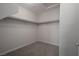 Interior walk-in closet featuring carpeting and shelving with storage racks at 2240 Sky Island Dr, Henderson, NV 89002