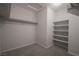 Walk-in closet has carpeting, top storage rack, and a shelf with storage areas at 2240 Sky Island Dr, Henderson, NV 89002