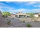 Landscaped backyard with gravel and desert plants at 2525 Hamonah Dr, Henderson, NV 89044