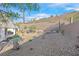 Large backyard with gravel and hillside views at 2525 Hamonah Dr, Henderson, NV 89044