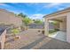 Landscaped backyard with gravel and covered patio at 2525 Hamonah Dr, Henderson, NV 89044