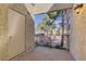 Cozy balcony featuring wood flooring, metal railings, and textured stucco walls, providing a relaxing outdoor space at 2801 N Rainbow Blvd # 255, Las Vegas, NV 89108