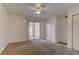 Serene bedroom with neutral carpet, ceiling fan and a private outdoor balcony at 2801 N Rainbow Blvd # 255, Las Vegas, NV 89108