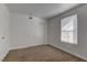 Cozy bedroom with neutral carpet, closet with classic doors, and a window providing natural light at 2801 N Rainbow Blvd # 255, Las Vegas, NV 89108