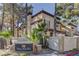 Condominium complex with desert landscaping, block wall and sign reading 