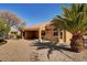 Desert landscaping with gravel and a covered patio at 3021 Isaac River Dr, Las Vegas, NV 89134