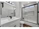 Modern bathroom with white cabinets and a walk-in shower at 3021 Isaac River Dr, Las Vegas, NV 89134