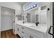 Modern bathroom with white cabinets, quartz countertops, and walk-in shower at 3021 Isaac River Dr, Las Vegas, NV 89134