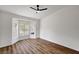 Bright bedroom with wood-look floors and bay window at 3021 Isaac River Dr, Las Vegas, NV 89134