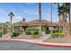 Community clubhouse with palm trees and landscaping at 3021 Isaac River Dr, Las Vegas, NV 89134