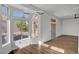 Dining area with large windows and wood-look floors at 3021 Isaac River Dr, Las Vegas, NV 89134