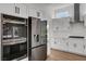 Modern kitchen with stainless steel appliances and white cabinets at 3021 Isaac River Dr, Las Vegas, NV 89134