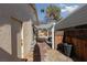 Side yard with pergola, fence, and access to the back patio at 3126 Cabachon Ave, Las Vegas, NV 89121