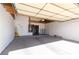 Attached garage with storage shelving and water heater at 3126 Cabachon Ave, Las Vegas, NV 89121