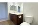 Bathroom features a vanity, toilet, and a mirror at 3317 Barada Heights Ave, North Las Vegas, NV 89081