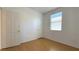 Cozy bedroom featuring hardwood floors, window, and a closet with bi-fold doors at 3317 Barada Heights Ave, North Las Vegas, NV 89081