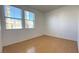 Bright bedroom features wood-look floors, neutral walls and natural light from the sunny window views at 3317 Barada Heights Ave, North Las Vegas, NV 89081