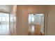 Hallway with light walls and wood flooring leading to bedroom at 3317 Barada Heights Ave, North Las Vegas, NV 89081