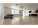 Bright and spacious living room featuring tile flooring, recessed lighting, and large windows at 3317 Barada Heights Ave, North Las Vegas, NV 89081