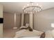 Luxurious bedroom with a chandelier and city views at 3722 Las Vegas Blvd # 1712, Las Vegas, NV 89158