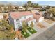 Two-story house with artificial turf, two-car garage, and solar panels, mountain view at 3728 Shimmering Creek Ave, North Las Vegas, NV 89031