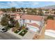 Two-story house with artificial turf, two-car garage, and solar panels, mountain view at 3728 Shimmering Creek Ave, North Las Vegas, NV 89031