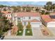 Two-story house with artificial turf, two-car garage, and solar panels, mountain view at 3728 Shimmering Creek Ave, North Las Vegas, NV 89031