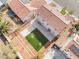 Artificial turf backyard, tiered landscaping, and a view of the home's exterior at 3728 Shimmering Creek Ave, North Las Vegas, NV 89031