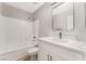 Clean bathroom with white vanity, quartz countertop and bathtub at 3728 Shimmering Creek Ave, North Las Vegas, NV 89031