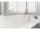 Soaking tub in a bright and airy bathroom at 3728 Shimmering Creek Ave, North Las Vegas, NV 89031