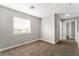 Spacious bedroom with carpet, window, and hallway access at 3728 Shimmering Creek Ave, North Las Vegas, NV 89031