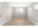 Bright dining area with light gray walls and wood flooring at 3728 Shimmering Creek Ave, North Las Vegas, NV 89031