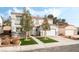 Two-story house with a white exterior, two-car garage, and landscaped front yard at 3728 Shimmering Creek Ave, North Las Vegas, NV 89031