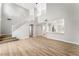 Spacious living room with hardwood floors and a staircase leading to the upper level at 3728 Shimmering Creek Ave, North Las Vegas, NV 89031